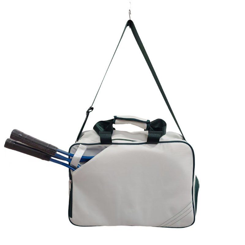 TN-R01 hanging by its shoulder strap, rackets in place