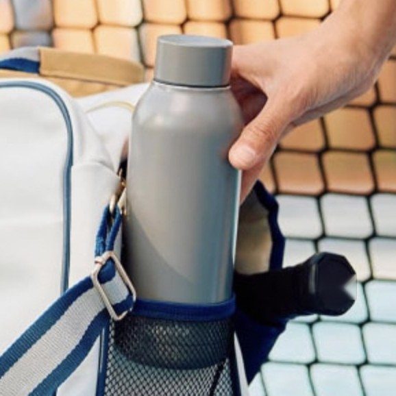 Pickleball duffel — mesh side pocket holding a water bottle